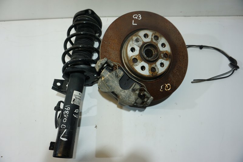 AUDI Q3 MCPHERSON ZWROTNICA AMORTYZATOR LEWY 5N0413031AG